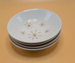 Four starburst ceramic dessert bowls